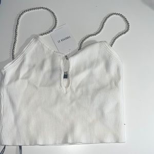 White knitted v neck opening crop top with beaded straps.